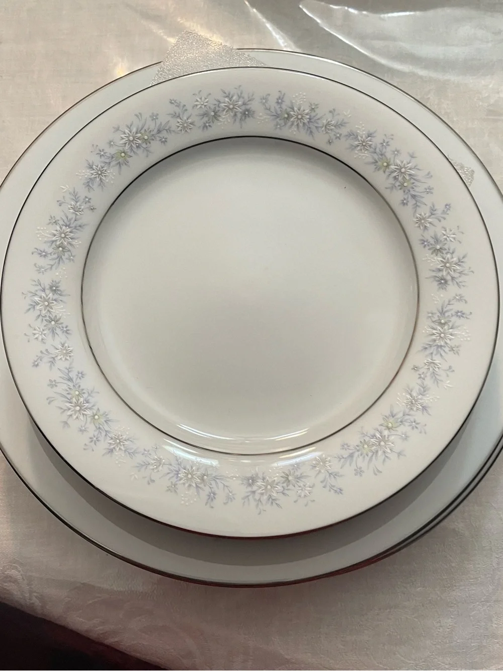 Noritake White Dinner Plate with Pale Blue Floral and Silver Trim
